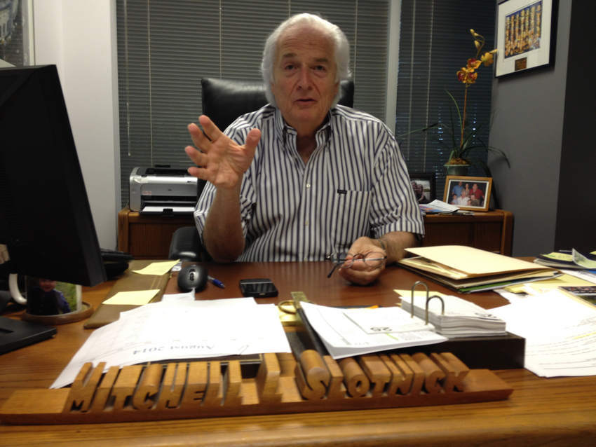 Northbrook resident Mitch Slotnick, photographed at his desk in Deerfield's Ridgebrook Travel, may wait more than four years for his cherished Northern Suburban Special Recreation Association to find a new home. | Irv Leavitt/Sun-Times Media